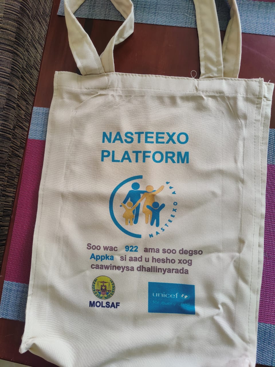 Official NASTEEXO Platform tote bag with MOLSAF and UNICEF logos and the national hotline number